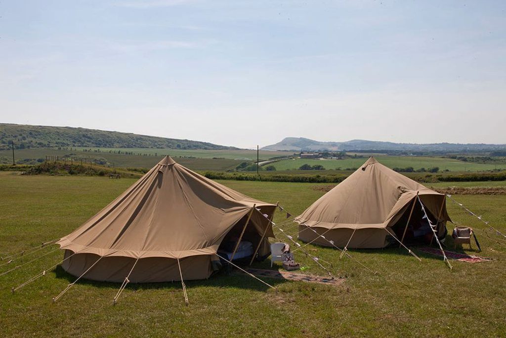 Furnished "eco safari" tents on the Isle of Wight in the UK, verified by Glamping Hub, a travel startup backed by Howzat Partners.