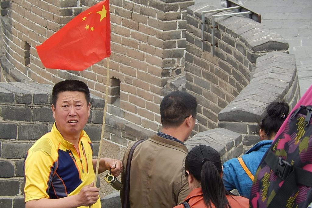 A tour guide in the Badaling section of the Great Wall in China as seen on April 16, 2014. Operating a tour business is not as easy as it might appear.  