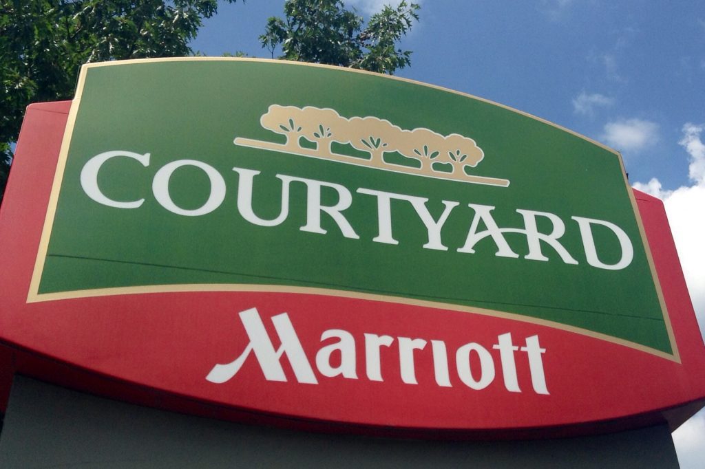 Courtyard by Marriott signage as seen August 5, 2014. Marriott is distributing wholesale rates through Expedia.