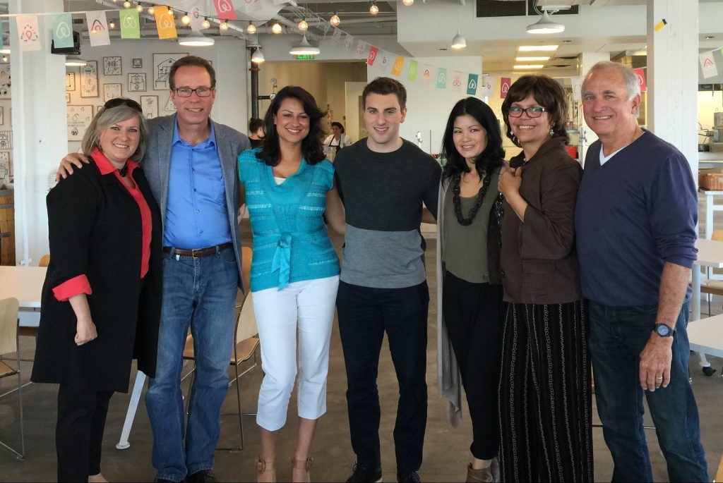 Airbnb co-founder and CEO Brian Chesky (center) posed with some San Francisco hosts after breakfast on June 3, 2015. Airbnb is creating an endowment fund to benefit hosts.