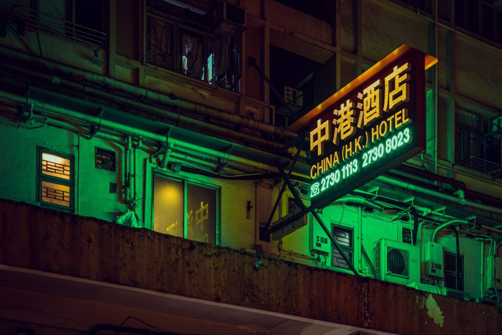 A neon sign for a hotel in Hong Kong; Trip.com is the largest online travel agency in China.