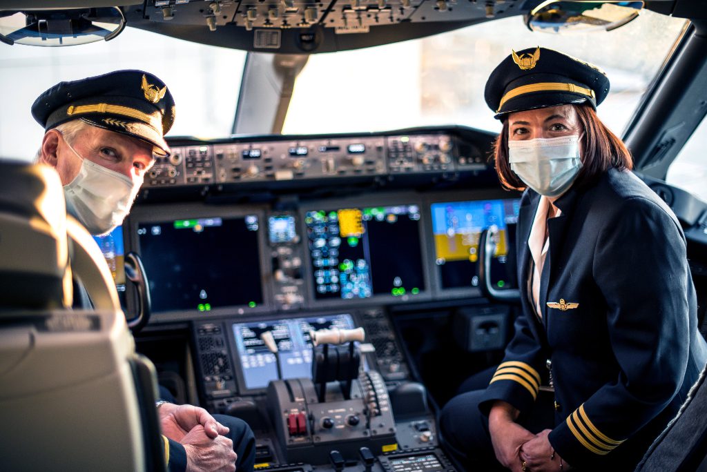 Two pilots prepare to fly during the coronavirus pandemic. 