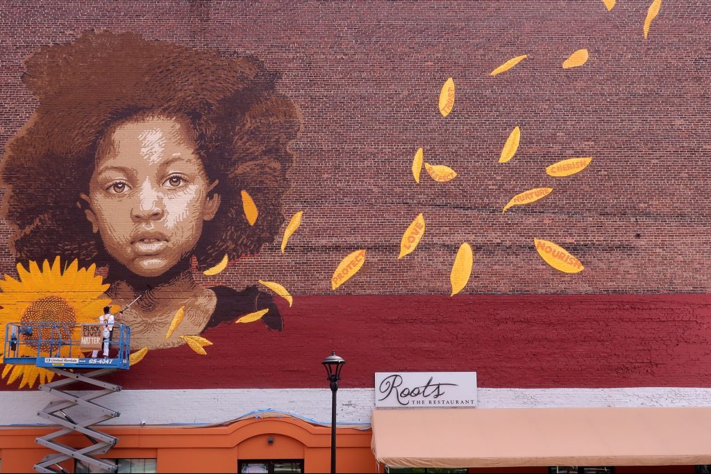 The “We Who Believe in Freedom Rest Unit Comes,” a 60-foot high mural in Rutland, Vermont created by Lopi Laroe to pay tribute to the Black Lives Matter movement.