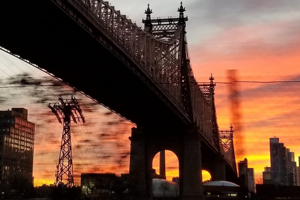 Sunrise on the Queensboro Bridge in New York, where JetBlue Joanna Geraghty would ride her bike to work in eerie quiet of the early days of the pandemic.