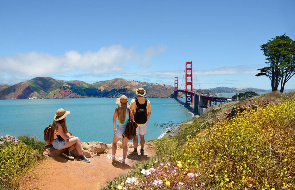 Family looking on hiking trip near Golden Gate Bridge, San Francisco, California. The U.S. travel industry awaits more specificity on domestic and international travel protocols from the Biden-Harris administration.