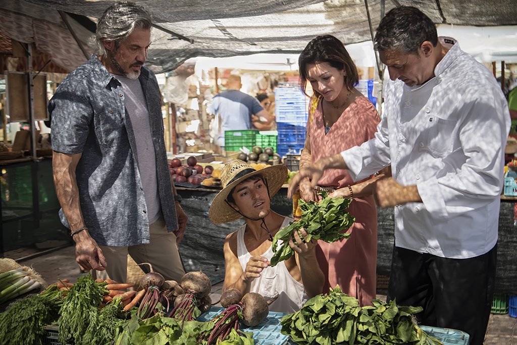 Windstar Cruises crew source vegetables at a market in Mallorca, Spain. 