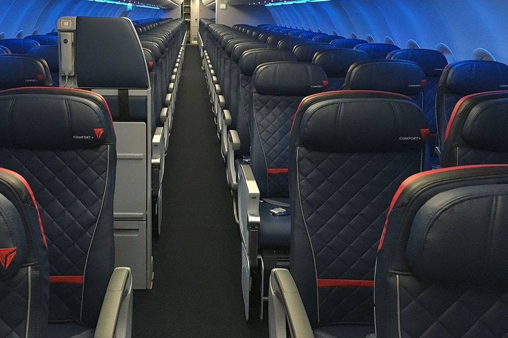 Interior of Delta Air Lines Airbus A321 shows the middle seat configuration and the limited space for social distancing on planes. 
