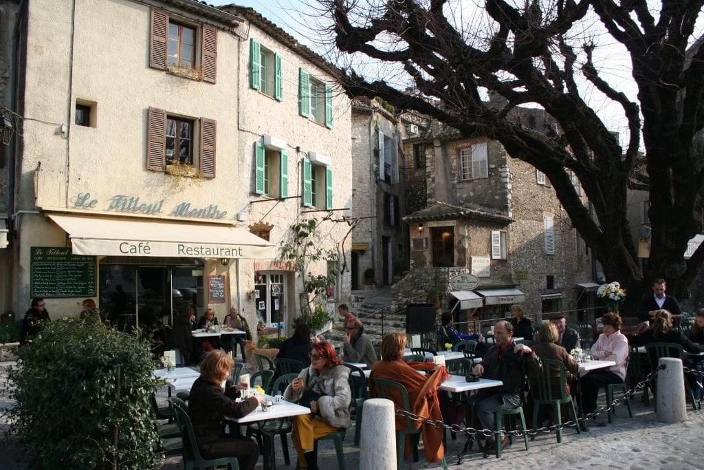 Patrons at an outdoor cafe in St. Paul de Vence, France. 