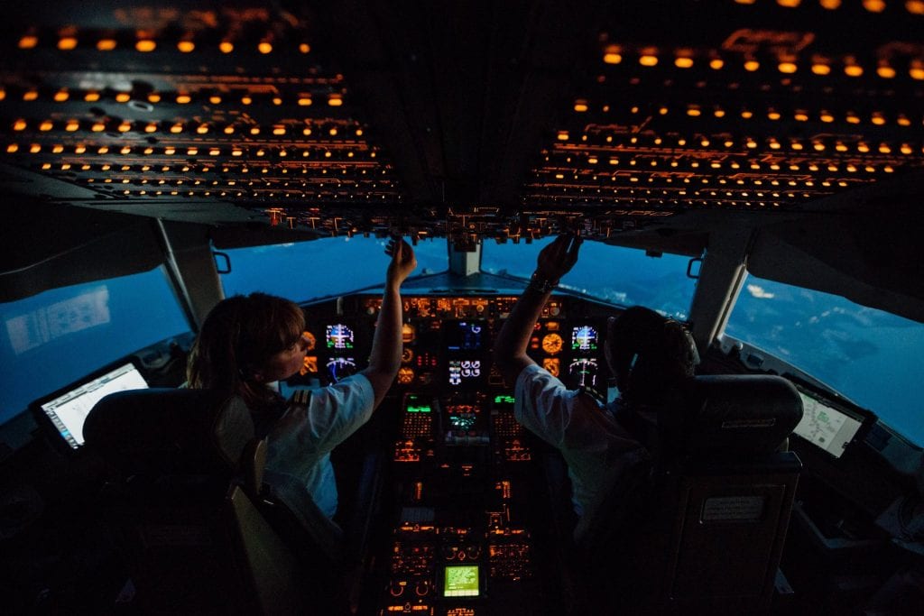 Delta pilots pictured here in flight deck pre-pandemic during a ferry flight from New York JFK to Orlando.