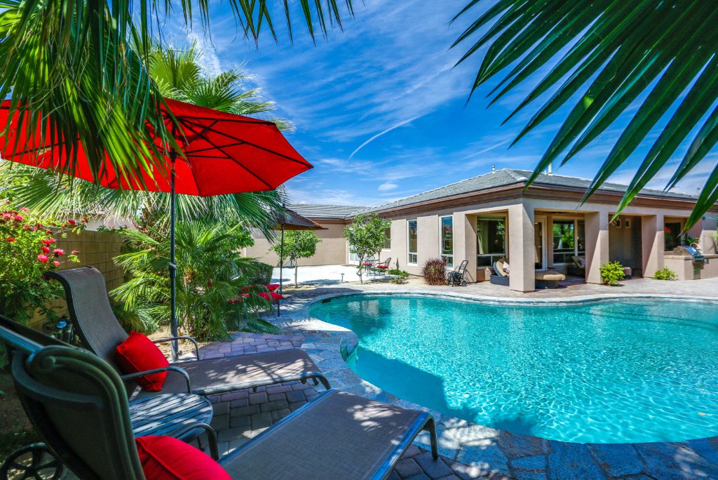 The poolside view of a vacation rental property in La Quinta, California, near the Indio Hills that's professionally managed by TurnKey. Vacasa, an online vacation rental company backed by private equity, has acquired TurnKey Vacation Rentals, a manager for 6,000 properties.