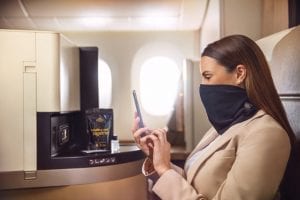 etihad airlines wellness business class passenger with mask safety source etihad