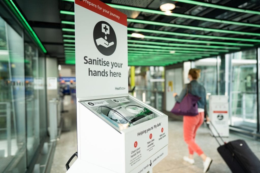 A sanitation station at Heathrow Airport. Arriving residents will no longer have to quarantine on return to the UK. 