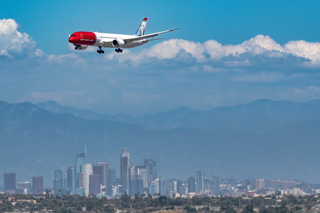 Norwegian Air (whose jet is pictured here above LAX) is set to emerge from bankruptcy this week.