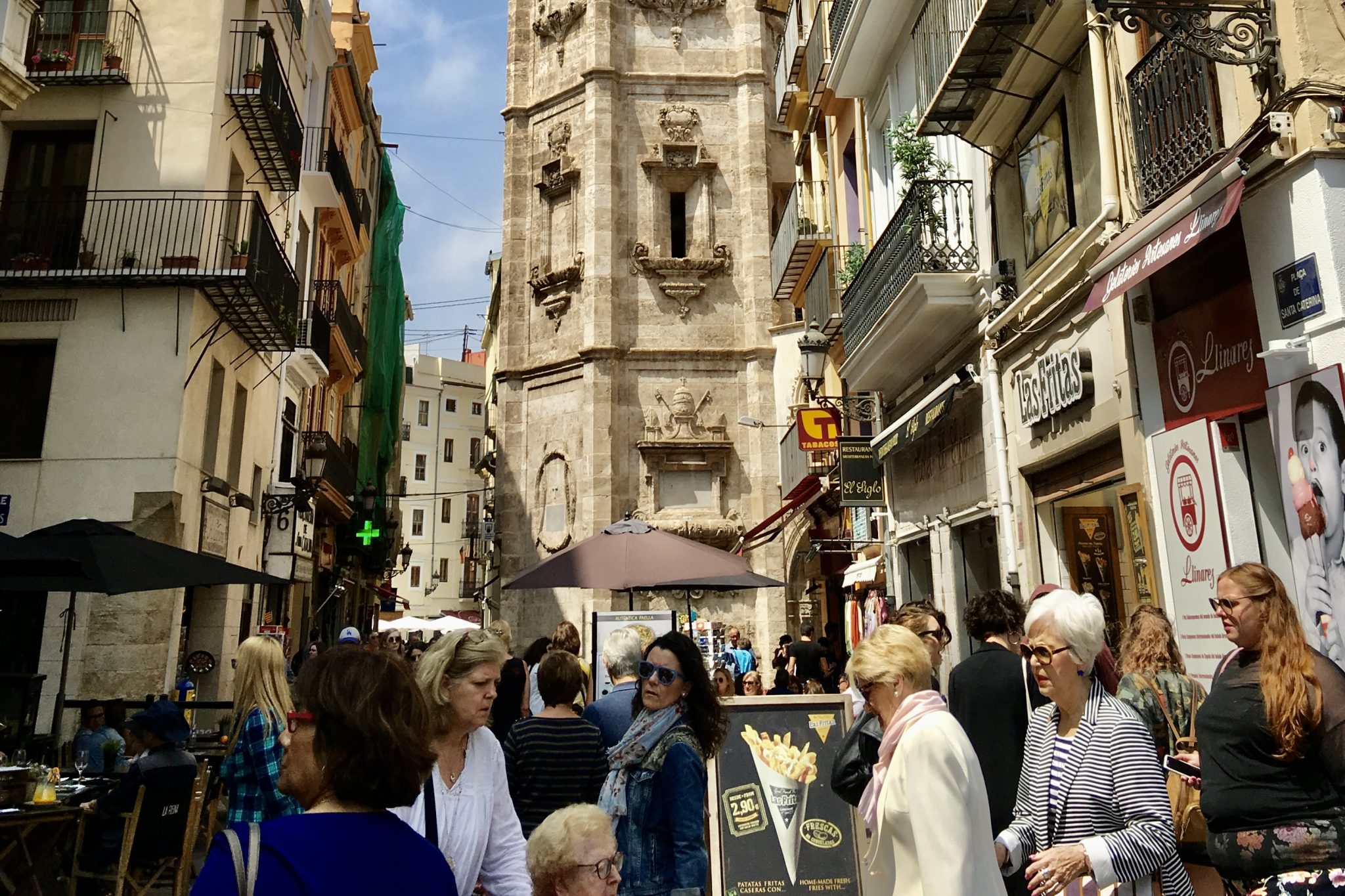 Pedestrians on a crowded street in Valencia, Spain in 2019. Spain is aiming to reach two-thirds of its 2019 numbers in Q4 this year. 