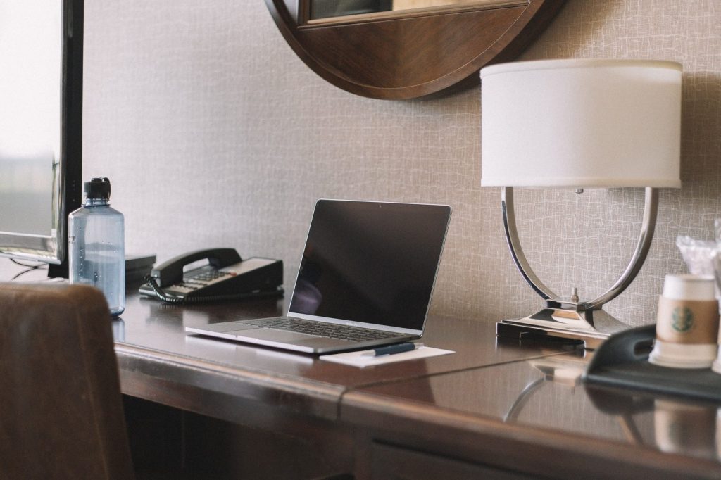 Hotel room desk with laptop