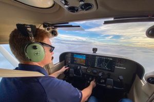 Coast Flight Training Student Flying a Plane