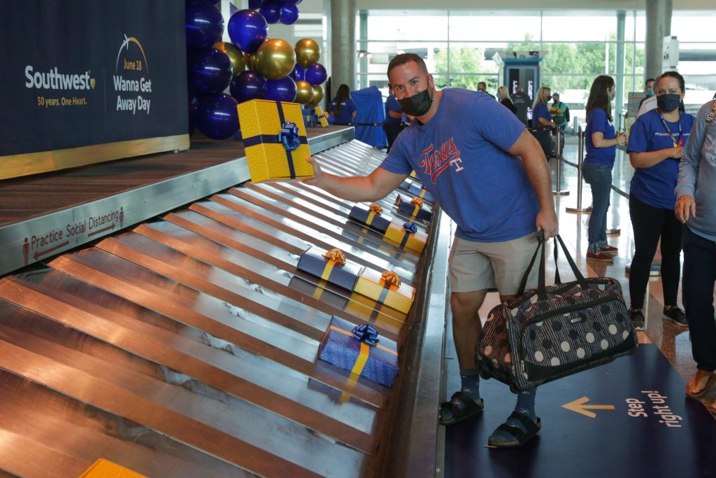 Skiplagged has drawn the wrath of Southwest Airlines for displaying the airline's flight information. Pictured is Southwest 50th Birthday baggage claim activation in Dallas, Texas on June 18, 2021. 