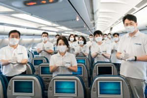Korean Air CEO joins in disinfecting aircraft cabin.