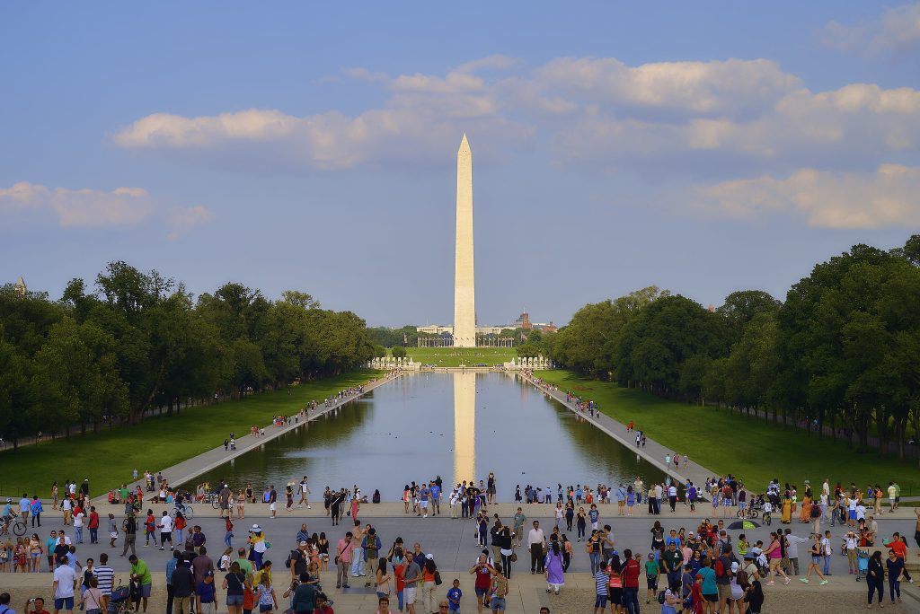 Crowds facing Washington DC Mall reflecting pool Pedro Szekely Flickr Commons e1627304963585