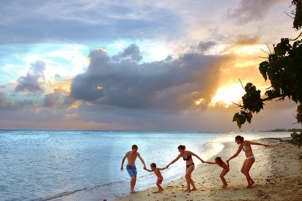 A family enjoys a vacation on the beach.