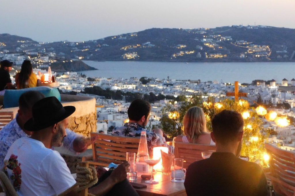 A restaurant in Mykonos, Greece in summer 2020.  Booking.com is doing well in Europe, likely taking back some market share.