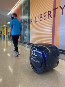 Robot helps with airport mobile order deliveries