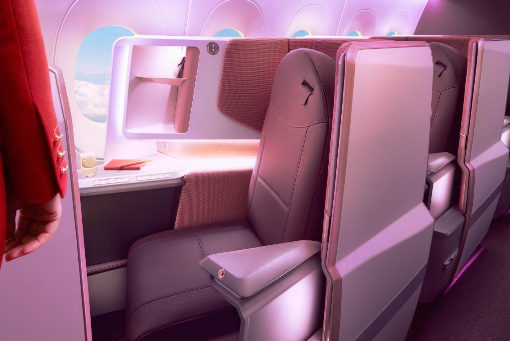 A seat on the upper deck of a Virgin Atlantic Airbus A350 in the daytime.