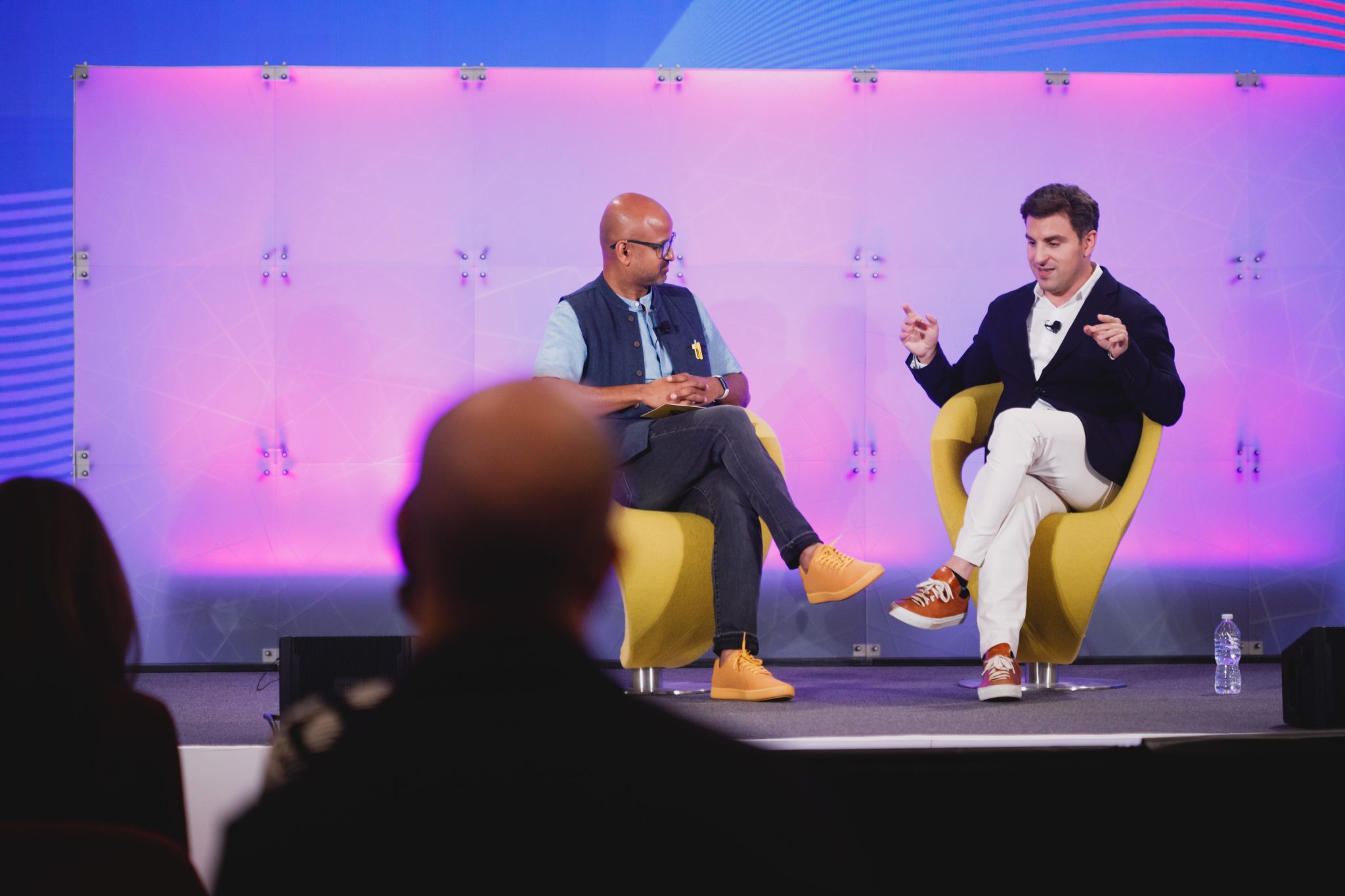 Airbnb CEO Brian Chesky speaking with Skift Founder Rafat Ali