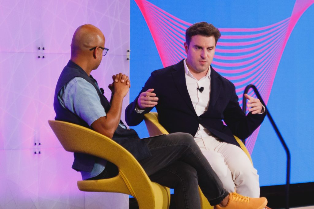 Airbnb CEO Brian Chesky (right) with Skift founder Rafat Ali discussing the future of travel at Skift Global Forum in New York's TWA Hotel Tuesday evening.