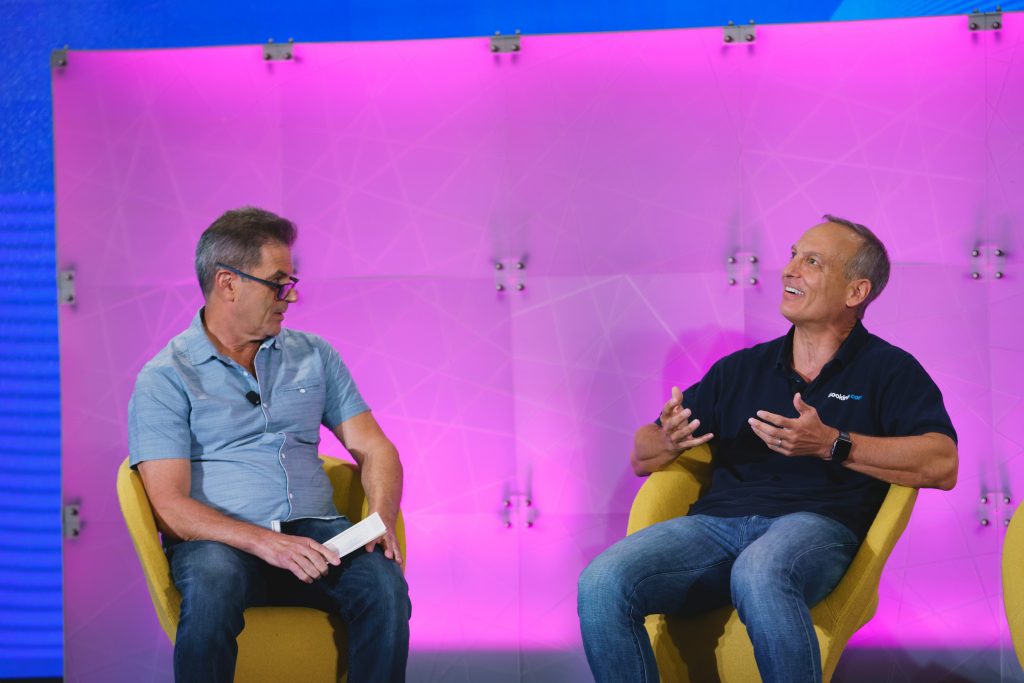 Booking Holdings CEO Glenn Fogel (right), who spoke at Skift Global Forum in New York in September, had a couple of acquisitions on the front burner.