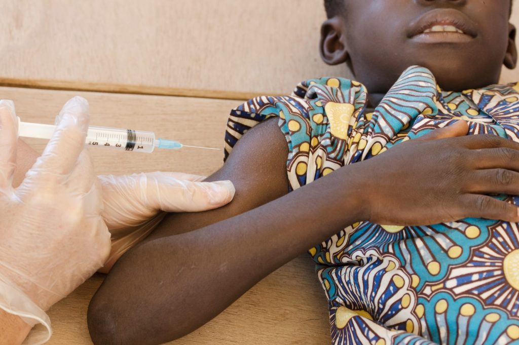 African child receiving vaccine. 