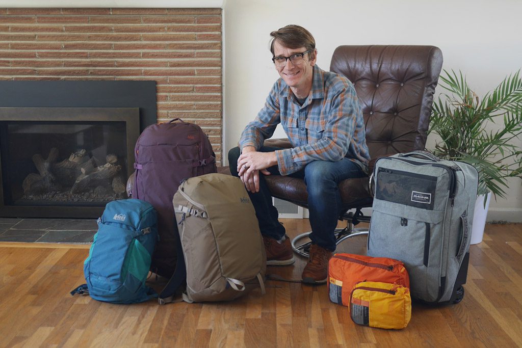 Graeme Wagoner among his packs and luggage that he has designed. 
