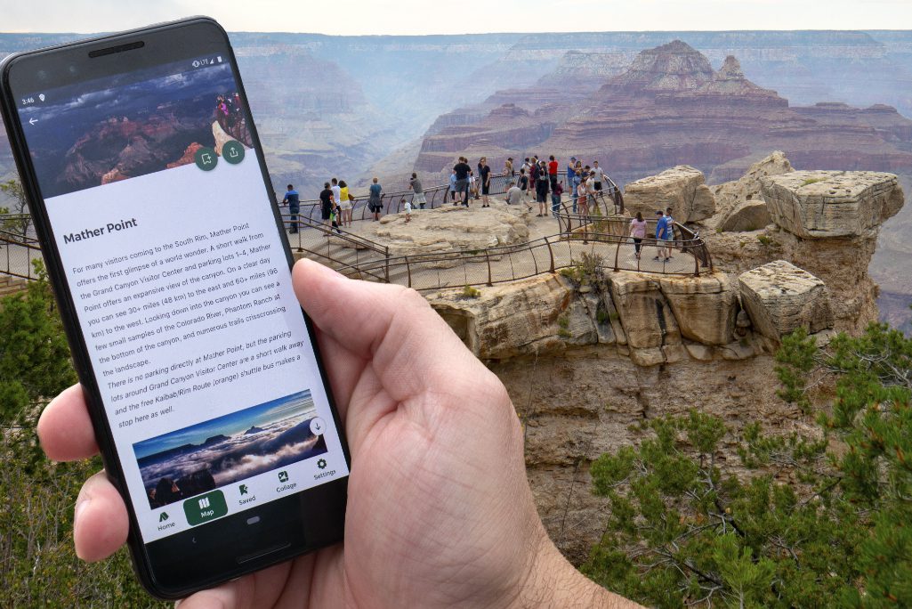 The Grand Canyon National Park in Arizona offers an official park app. In the background, people at a scenic overlook with peak visible in the distance. Source: M.Quinn for the U.S. National Park Service