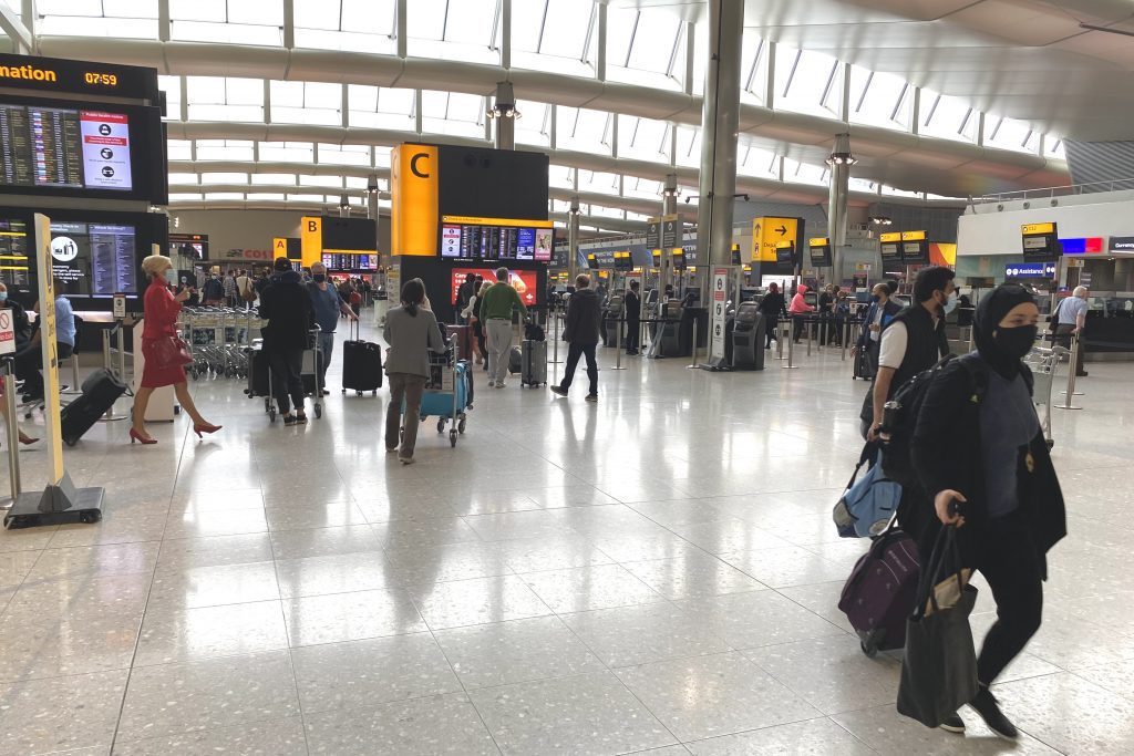Passengers at Heathrow Airport Terminal 2 departures. 
