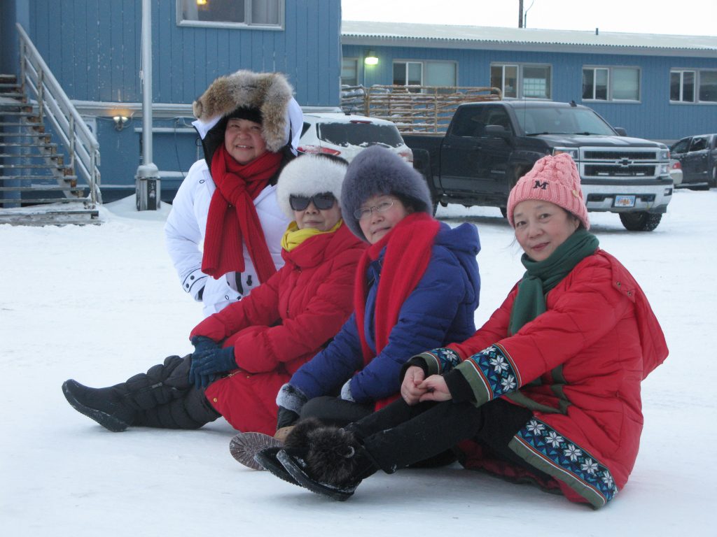 A group of visitors from China enjoying winter in Alaska