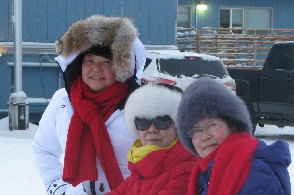 A group of visitors from China enjoying winter in Alaska
