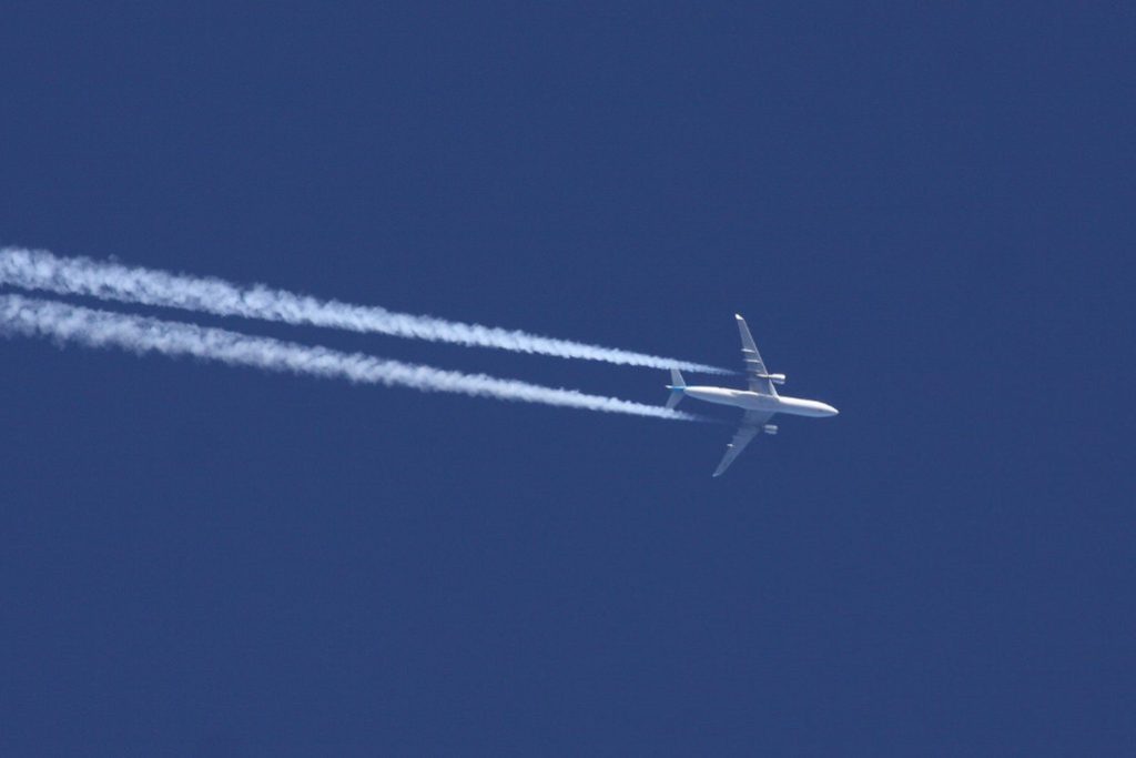 google flights carbon emissions image by Dean Morley of KLM airbus plane contrails 2020 source flickr Dean Morley