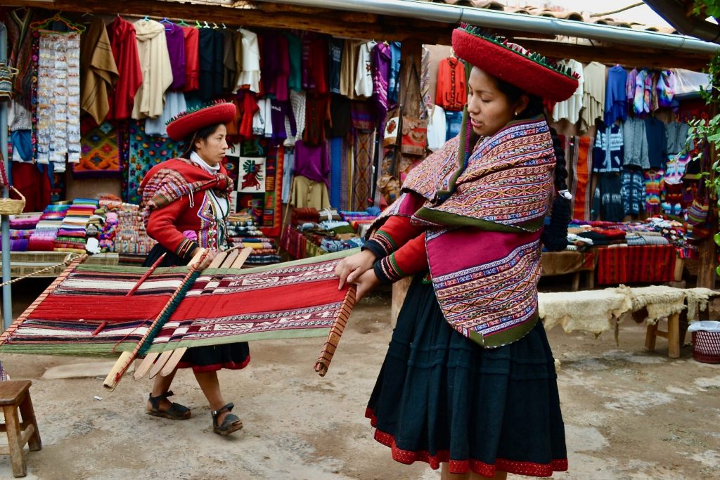 indigenous woman weaving in sacred valley peru by pamela huber