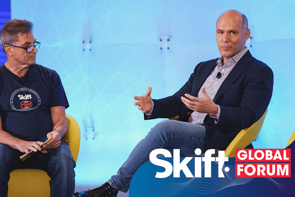Expedia Group Peter Kern (right) at Skift Global Forum in NYC in September 2021. The company said its Vrbo unit made market share gains. 
