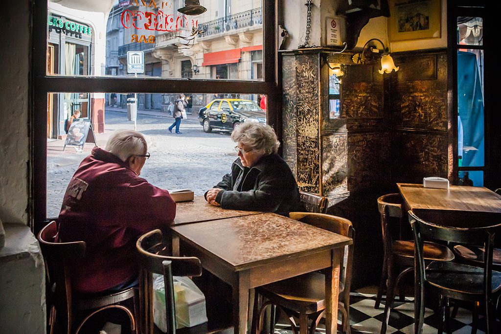 A couple waiting for a meal in Buenos Aires.