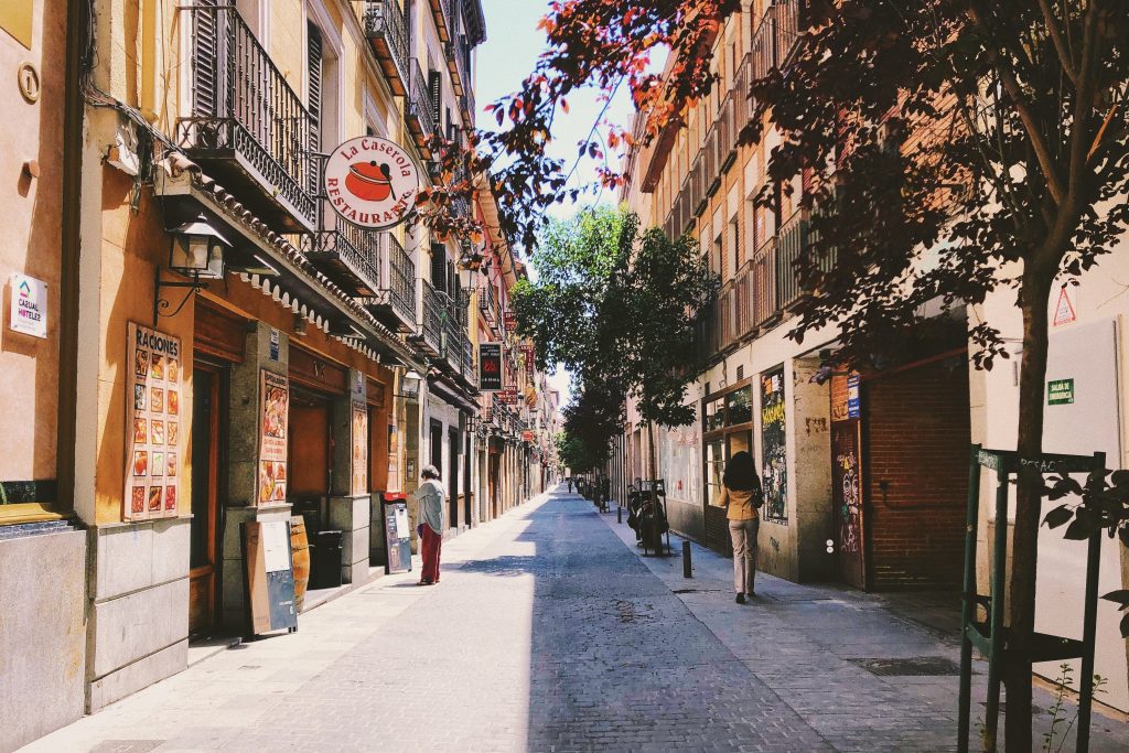 A pedestrian on a sunny street in Madrid, Spain. The country reported stronger foreign tourism numbers in October, 2021. 