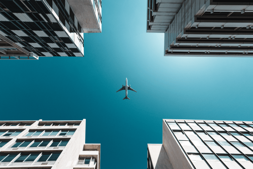 airplane flying over city