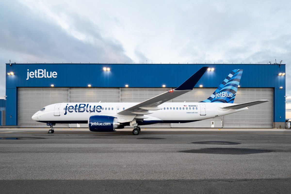 A JetBlue Airbus A220 aircraft outside of a hangar. Source: JetBlue.