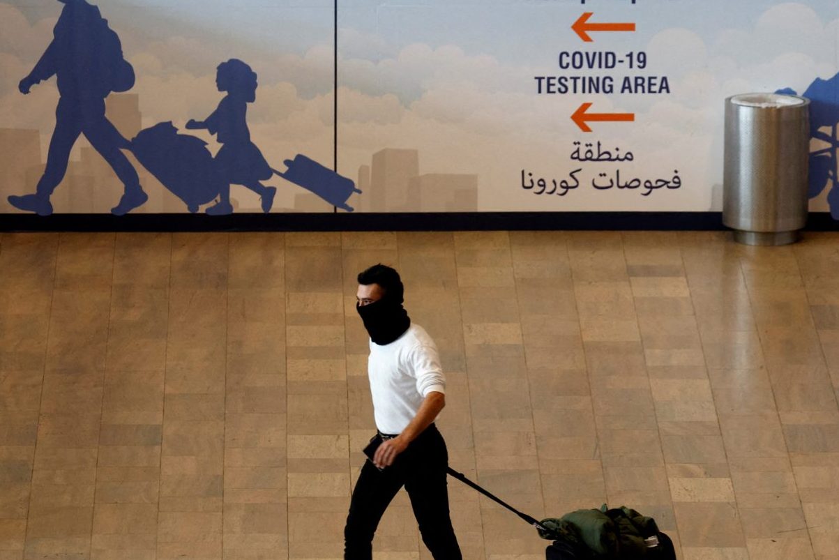 A traveler walks at Ben Gurion International Airport near Tel Aviv, Israel November 28, 2021