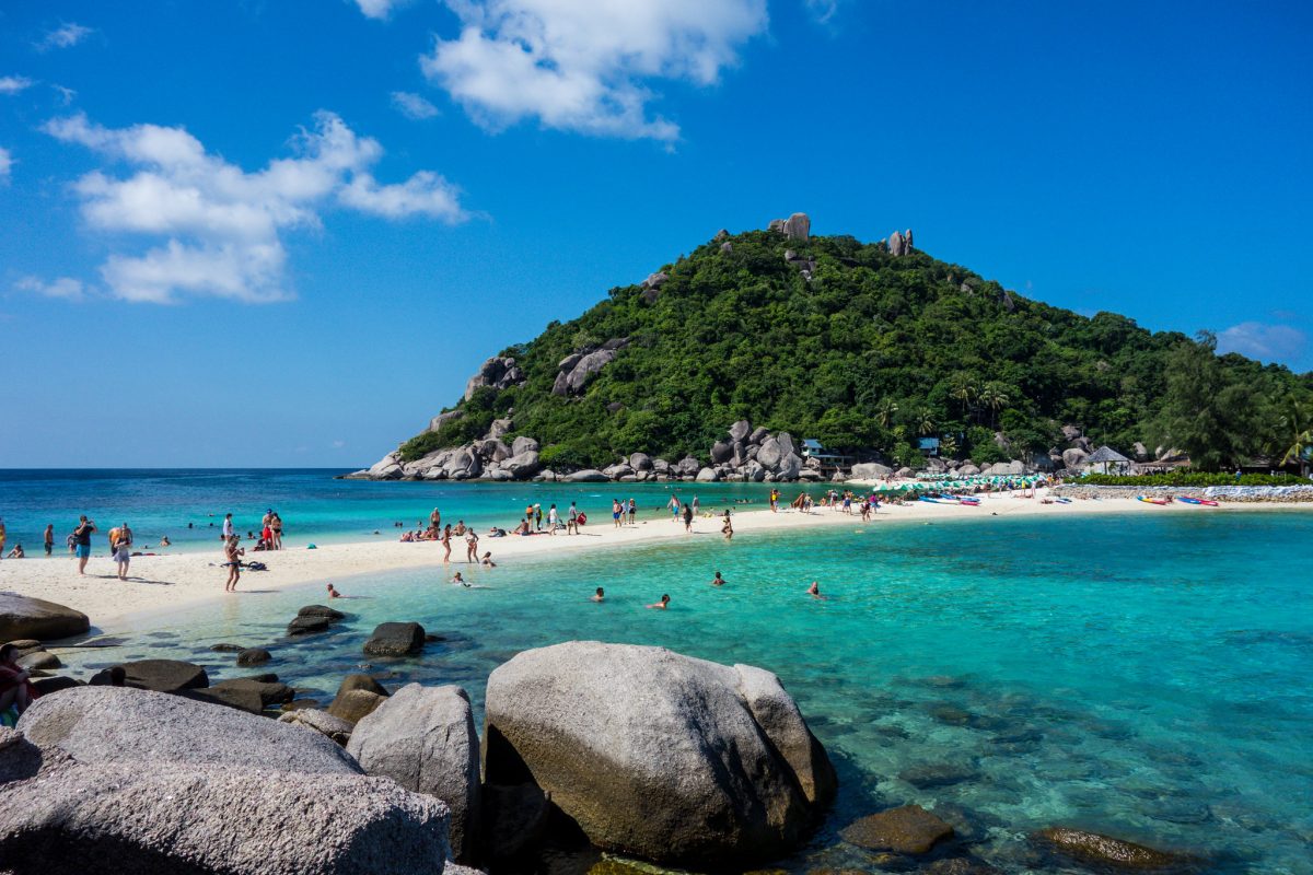 Tourists on Thailand's Koh Tao beach in a pre-pandemic image.