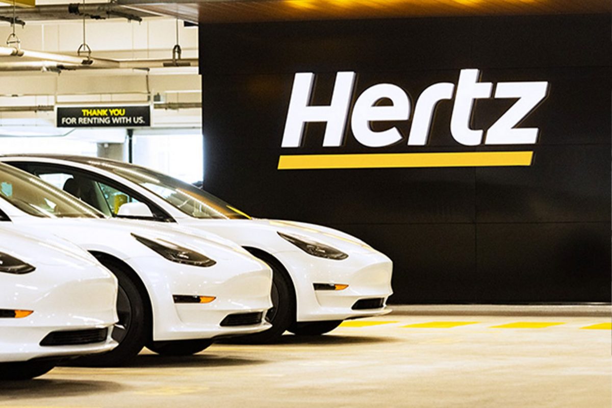 Tesla 3 electric vehicles at a Hertz airport location. The company appointed Stephen Scherr as its next CEO. 