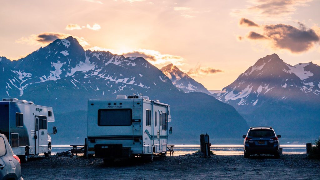 An RV sits at a lake in Seward, AK, USA