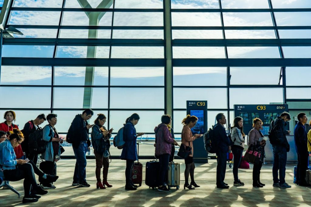 Travelers line at a Chinese airport.