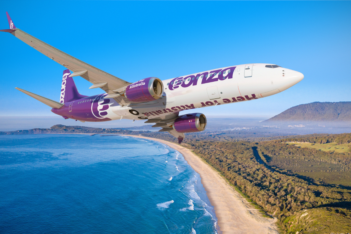 One of the Boeing Max aircraft in the livery of the Australian budget carrier Bonza, flying over Bonny Hills, with Grants beach below, and Middle Brother mountain in the distance near Port Macquarie. Source: Flair.