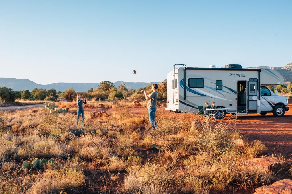 Family outside their RV in Arizona, USA.